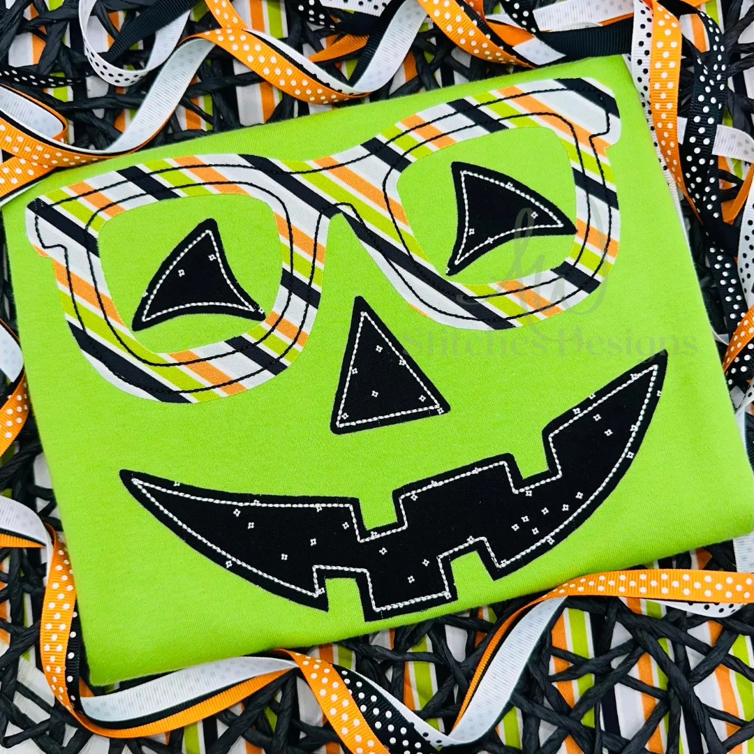 Jack o lantern pumpkin face with glasses bean stitch applique